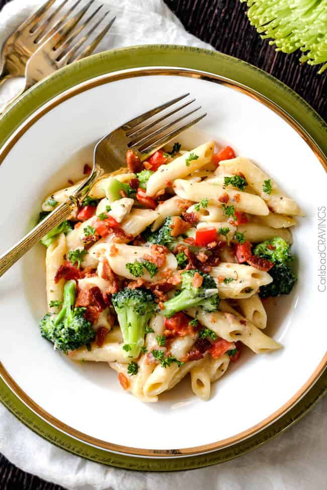 Cheesy Chicken Bacon Ranch Pasta with bacon bits on top.