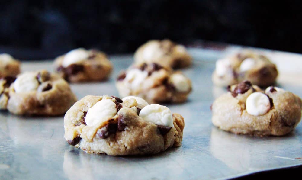 side view of unbaked smores cookies on baking tray