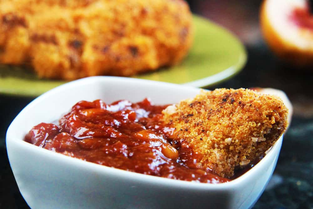Cajun chicken tenders dunked in barbecue sauce