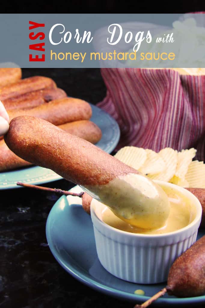 dipping a homemade corn dog into honey mustard sauce