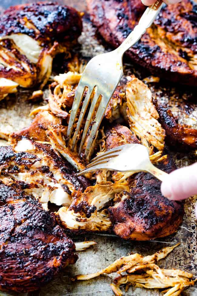 Showing how to make Smothered Buffalo Chicken Baked Burritos by cooking the chicken.