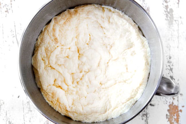 Showing how to make Homemade Pizza Dough by mixing dough in a mixing bowl ready to roll out.
