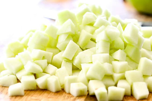 showing how to make apple syrup by chopping apples into cubes