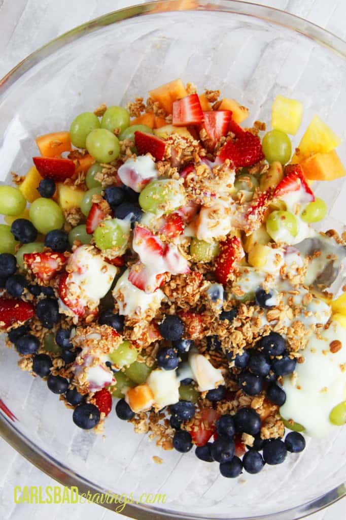 top view of creamy fruit salad with yogurt before tossing