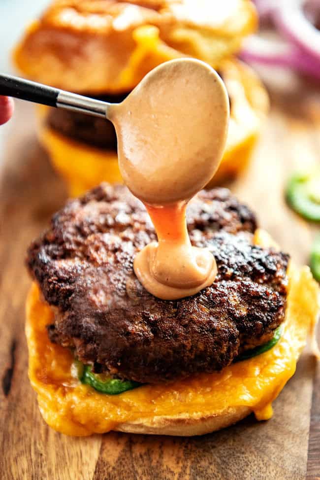 showing how to make burgers by adding barbecue mayonnaise to the patty