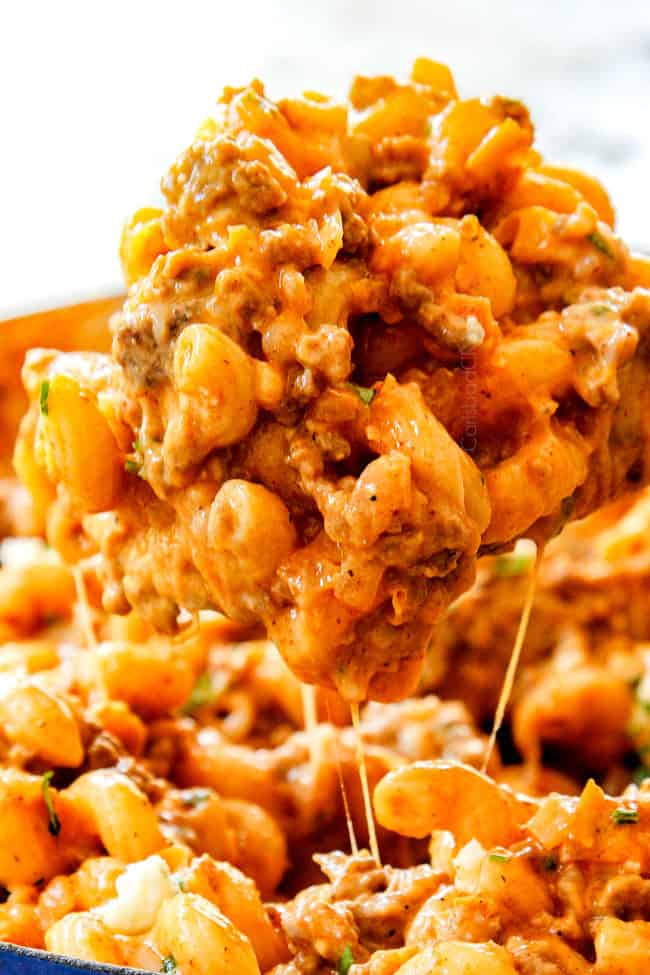 up close of a cheesy spoonful of buffalo wild wings mac and cheese