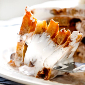 These AMAZING S'mores Pancakes make the funnest breakfast or dessert and are super easy! My nieces and nephews beg me to make them and I have to admit I can't enough of the marshmallow syrup! Don't skip the butterscotch chips!