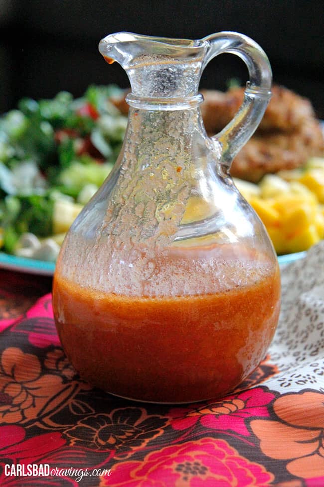 cashew chicken salad dressing in a glass pitcher