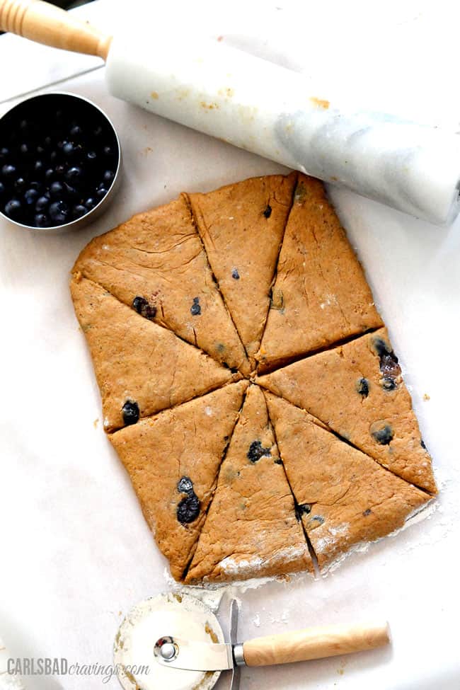 Showing how to make Pumpkin Scones by rolling the dough.