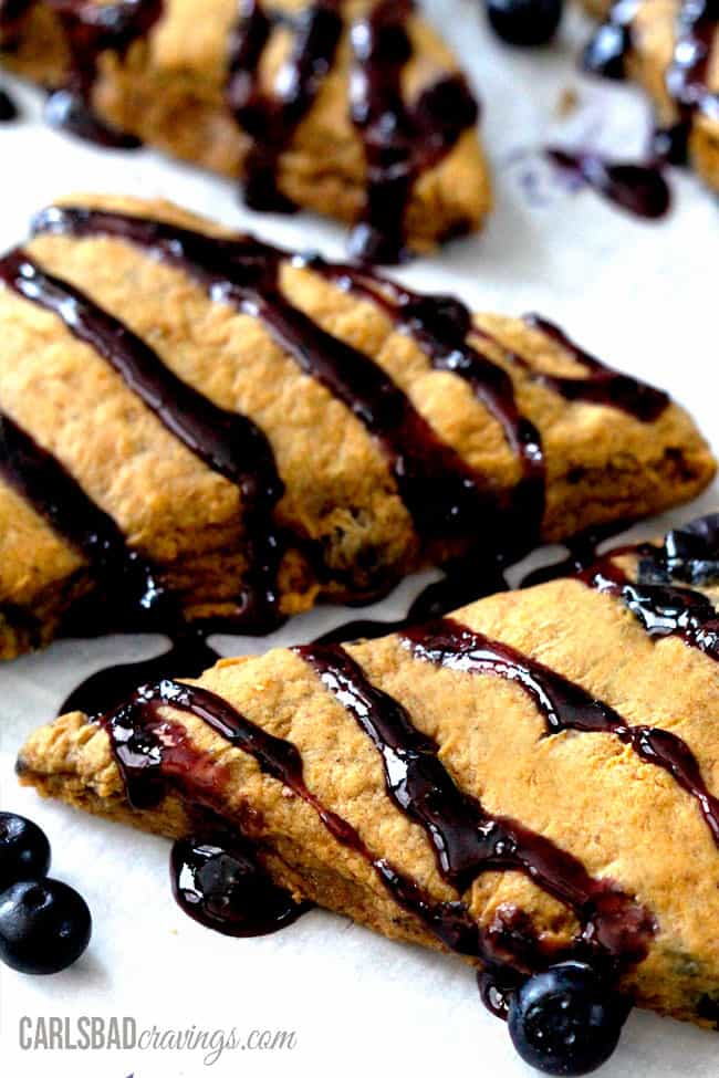 Close up view of Pumpkin Scones with a cinnamon blueberry glaze.