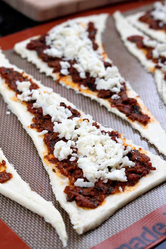 showing how to make crescent roll recipe by topping filling with cheese