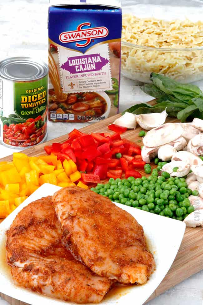 Showing how to make Cajun Chicken Pasta Soup showing ingredients to be used including chicken, peas, bell peppers.