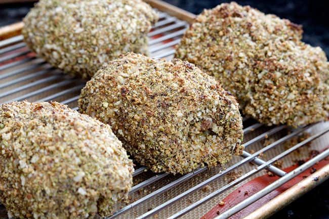 showing how to make easy chicken cordon bleu by adding adding chicken to baking sheet to bake