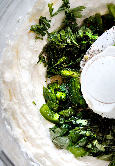 showing how to make whipped feta dip by mixing ingredients until smooth