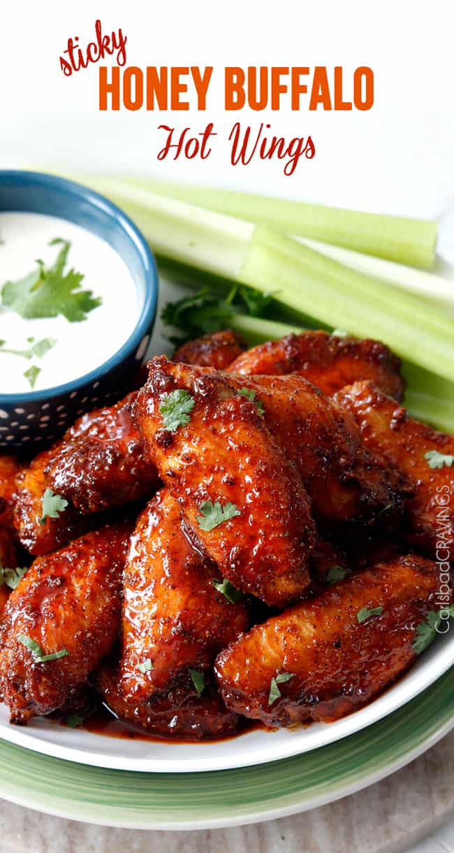 Honey Buffalo Hot Wings on a plate with celery and blue cheese dipping sauce.