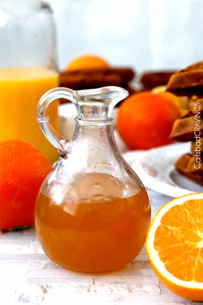 showing what to serve with Gingerbread waffles with a bottle of orange syrup