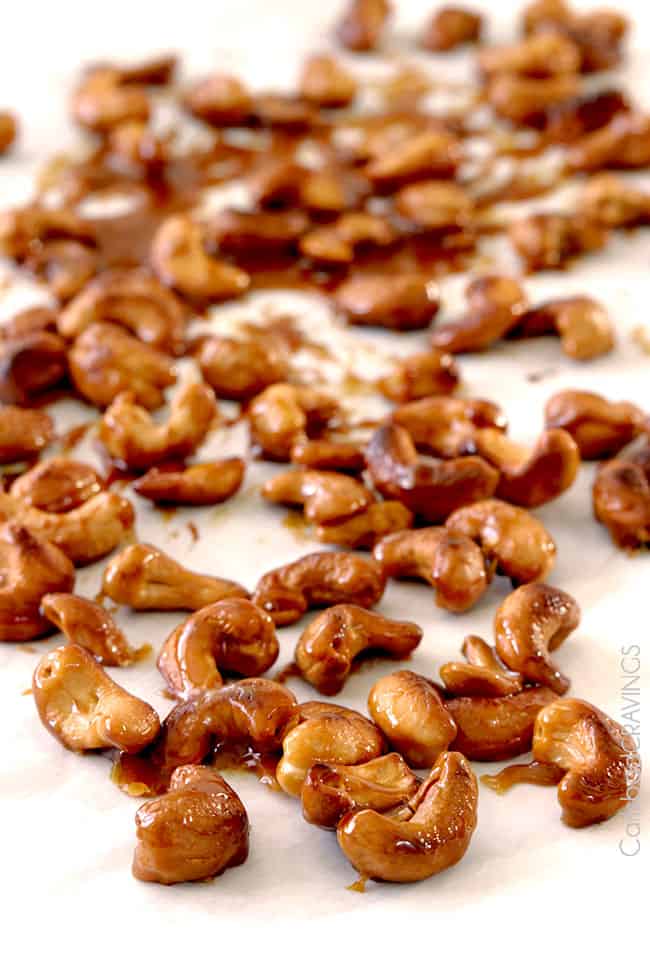 showing how to make cashew chicken stir fry by roasting cashews