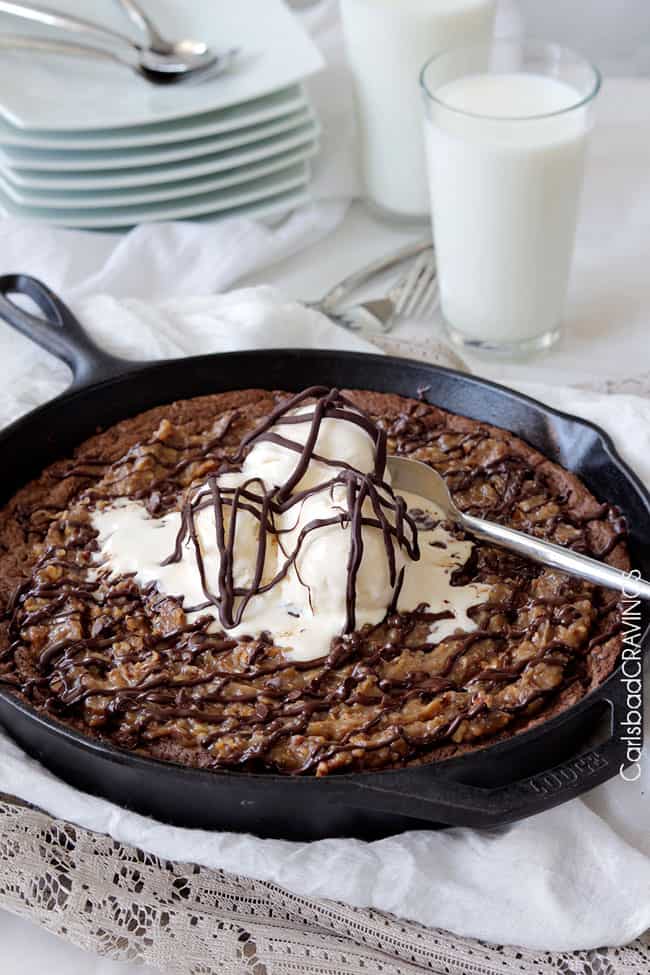 Side view of German Chocolate Cake Skillet Cookie with vanilla ice cream.