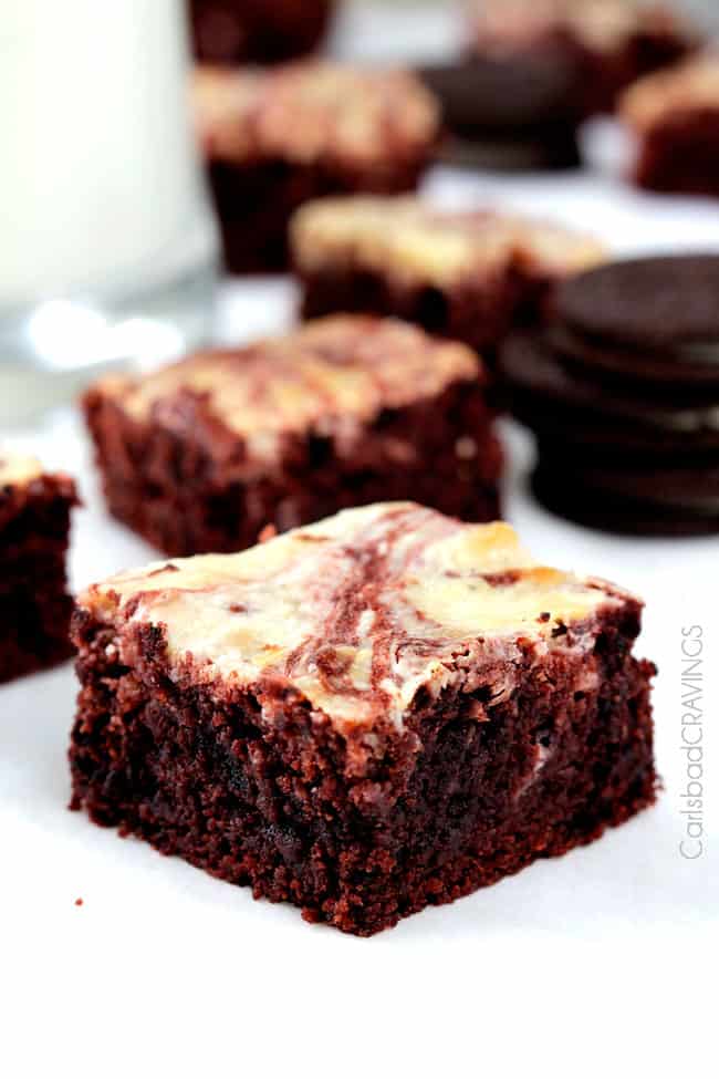 slices of red velvet brownies in front of glass of milk