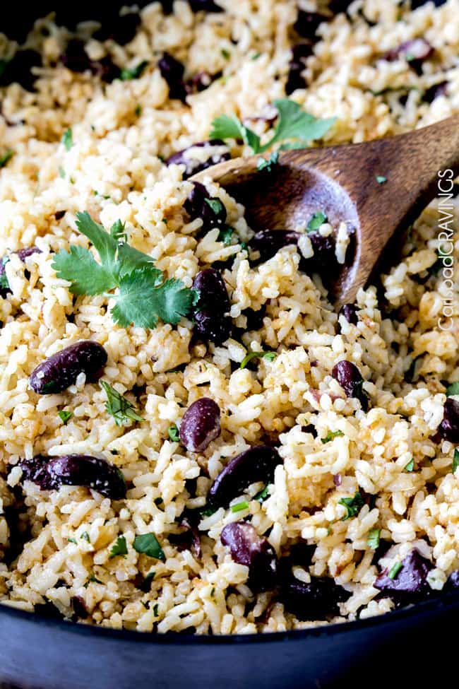 Close up view of Red Beans and Rice with a serving spoon in the rice.
