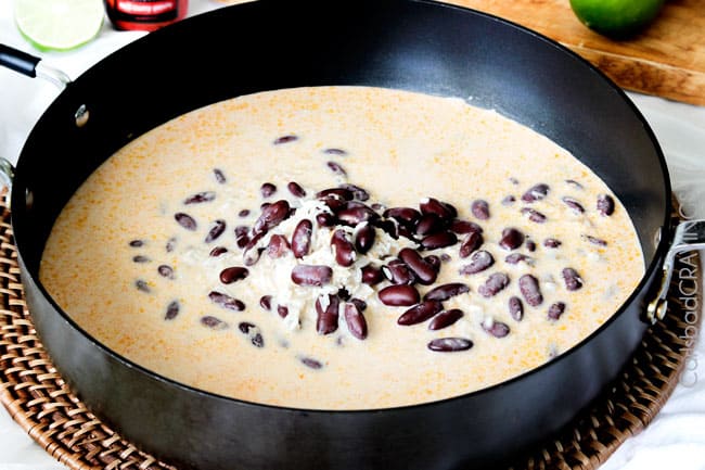 Showing how to make Red Beans and Rice by cooking beans in a black sauce pan.