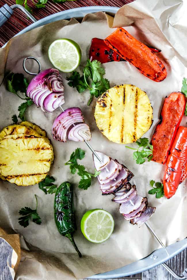 Showing how to make Pineapple Salsa by grilling fruit and vegetables for the salsa.