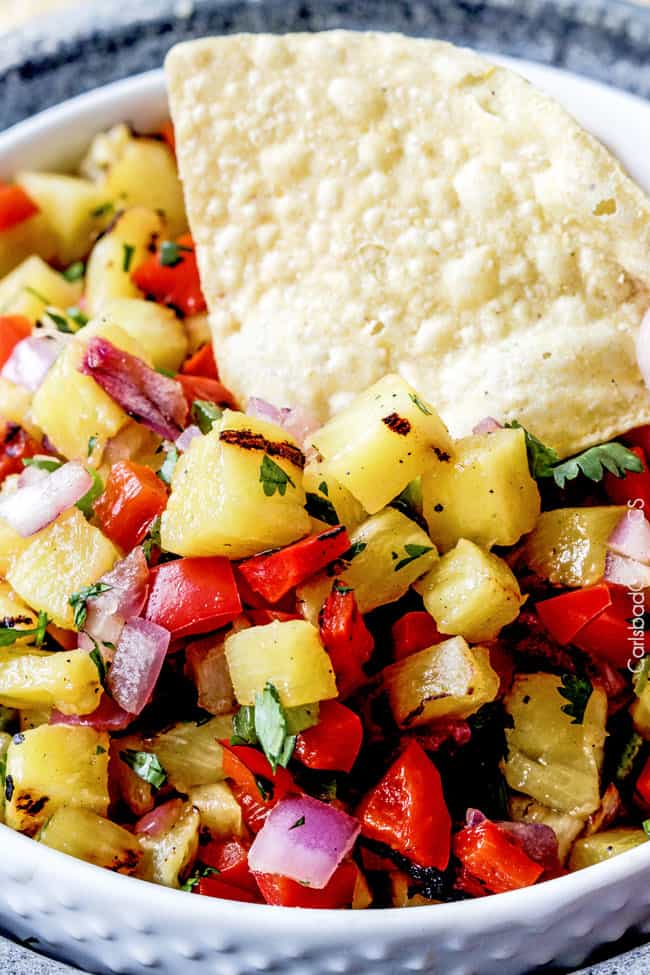 Sweet and smoky Grilled Pineapple salsa with not only grilled pineapple but GRILLED red bell peppers, red onions AND jalapeno! sweet and smoky and possibly the best salsa E-V-E-R alone, with chips, tacos or on fish/chicken. #pineapple #salsa #pineapplesalsa #grill
