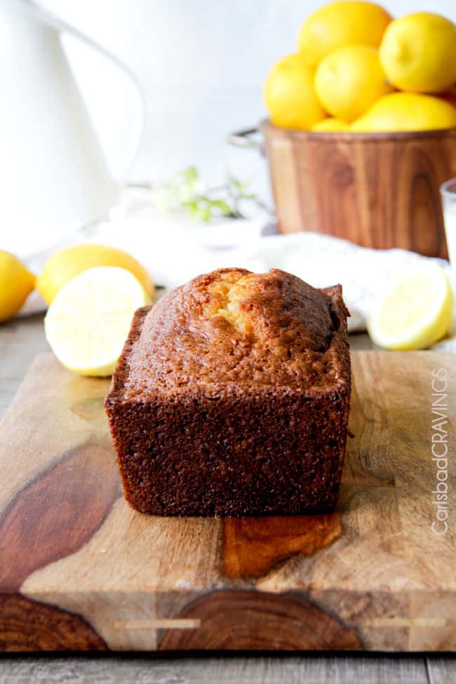 showing how to make lemon bread with a loaf comping out of the oven