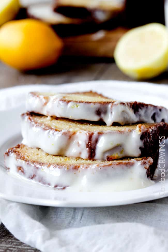 three slices of best lemon bread recipe on a white plate