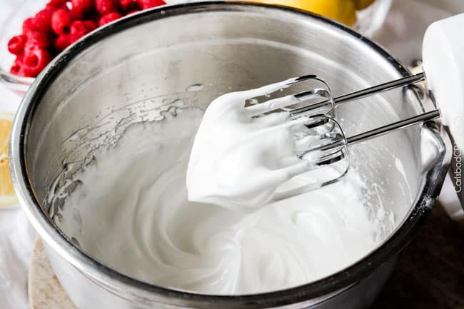Showing how to make Frozen Lemon Meringue Pie by mixing the meringue in a mixing bowl.