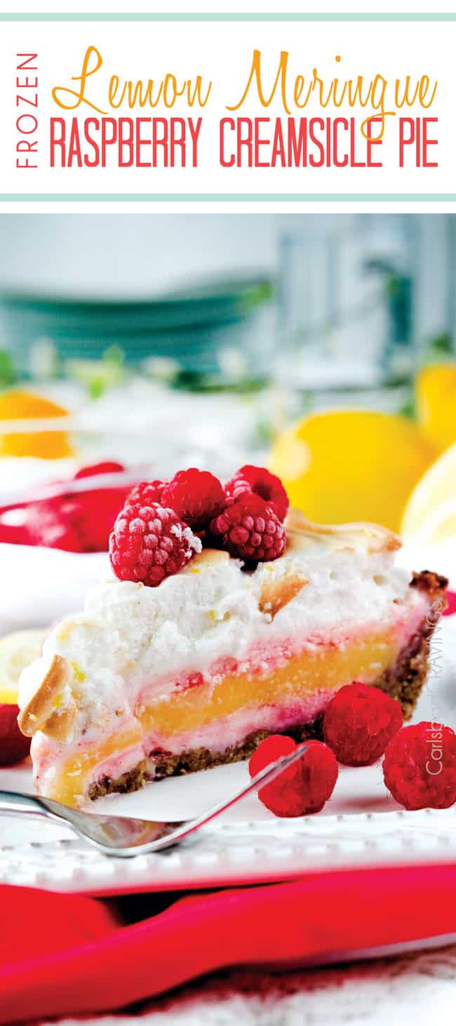 Frozen Lemon Meringue Pie on a white plate with raspberries and a fork.