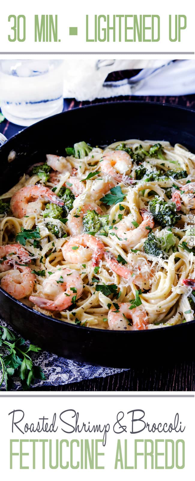 Shrimp Fettuccine Alfredo smothered in a velvety, creamy Alfredo sauce that's lightened up but tastes every bit as decadent as the finest restaurant Alfredo without any of the guilt or the price! This Roasted Shrimp Fettuccine Alfredo Recipe is bursting with juicy oven roasted shrimp. Shrimp Fettuccine Alfredo with broccoli in a black skillet garnished with Parmesan