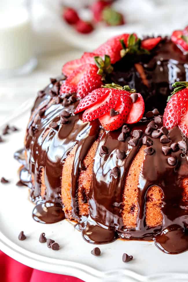 5 Minute Fool Proof Chocolate Ganache (sauce) is silky, creamy, sweet and 1,000 TIMES BETTER than any store bought chocolate sauce. Perfect for brownies, ice cream, cakes, popcorn, strawberries, etc side view of a cake covered with chocolate ganache glaze
