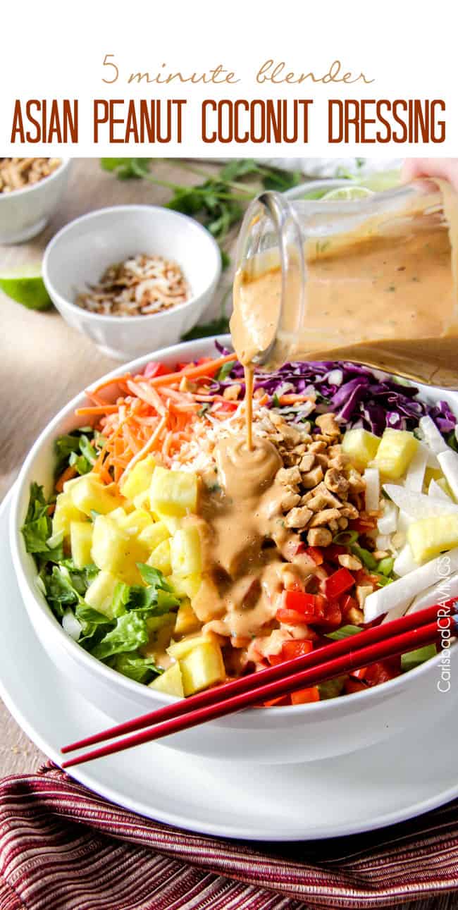 5 Minute Blender Asian Peanut Coconut Dressing (Thai Dressing) is so ridiculously delicious you will want to put it on everything! #dressing #salad #peanut #Asian pouring spicy Thai Peanut Dressing over a salad