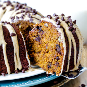 Moist, rich Chocolate Chip Pumpkin Cake infused with chocolate and bathed in in Cinnamon Pumpkin Cream Cheese Glaze is SO good! The only cake you need for Fall!