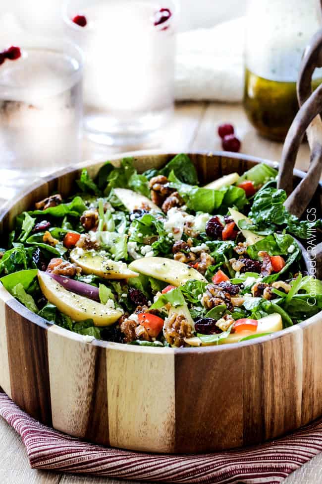 apple walnut salad recipe being served in a wooden bowl