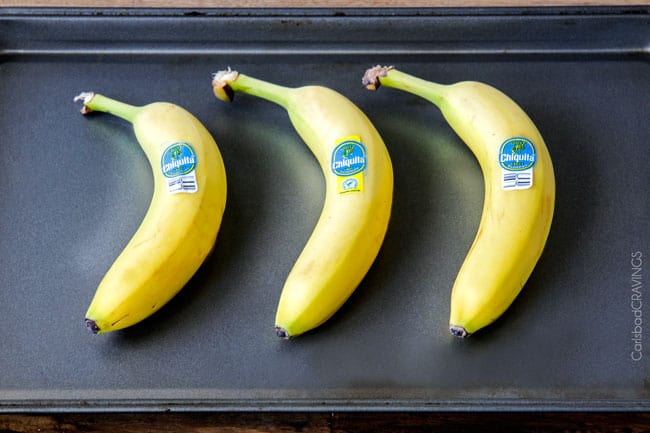 The best Banana ANYTHING ever! Moist Banana Coffee Cake riddled with chocolate chips and walnuts (optional) with an INCREDIBLY creamy cheesecake-like cream cheese filling all topped with brown sugar walnut streusel and vanilla drizzle.