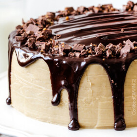Crazy moist Caramel Milk Chocolate Cake, busting with milk chocolate toffee bits, coated in Caramel Icing and smothered in silky chocolate ganache. THE only chocolate cake recipe you need!