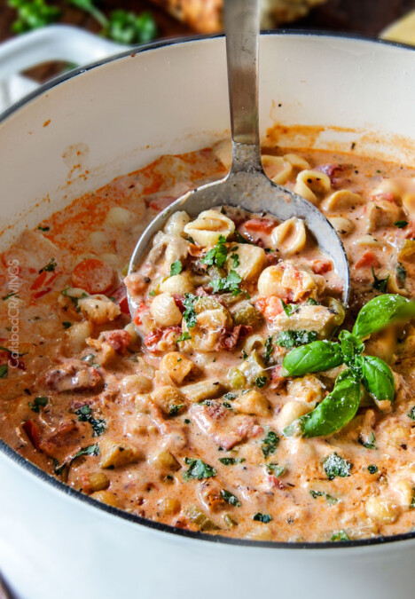 Creamy Basil Parmesan Italian Soup tastes better than any restaurant soup! Super easy and seasoned to perfection bursting with tender chicken, tomatoes, carrots, celery and macaroni enveloped by creamy Parmesan.