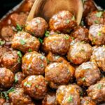 Tender juicy slow cooker Honey Buffalo Meatballs simmered in the most tantalizing sweet heat sauce that everyone goes crazy for! Perfect appetizer or delicious, easy meal with rice!