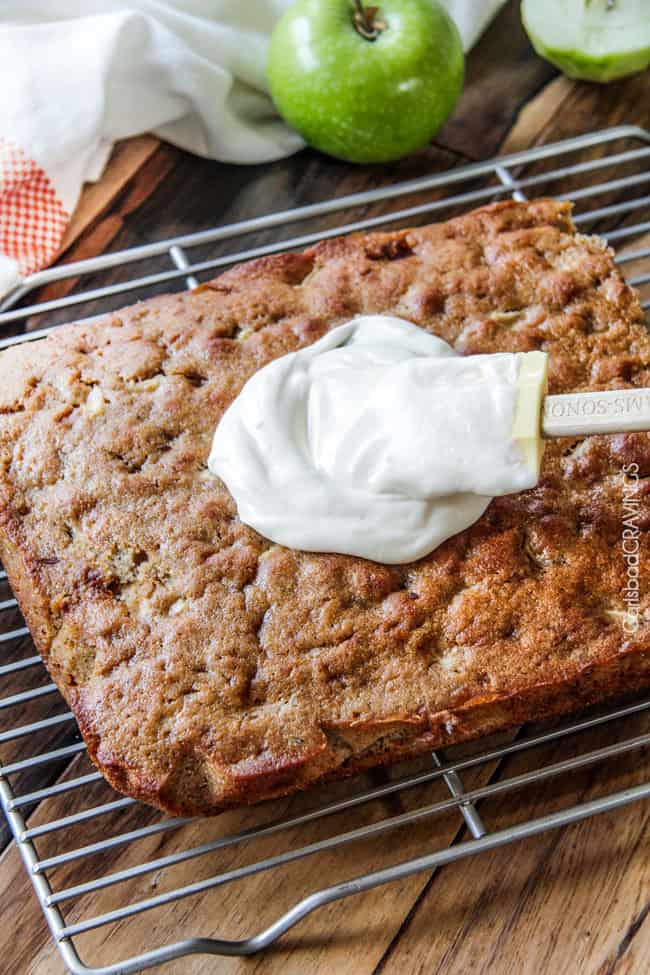 Showing how to make Maple Apple Spice Cake by adding Spiced Cream Cheese Frosting