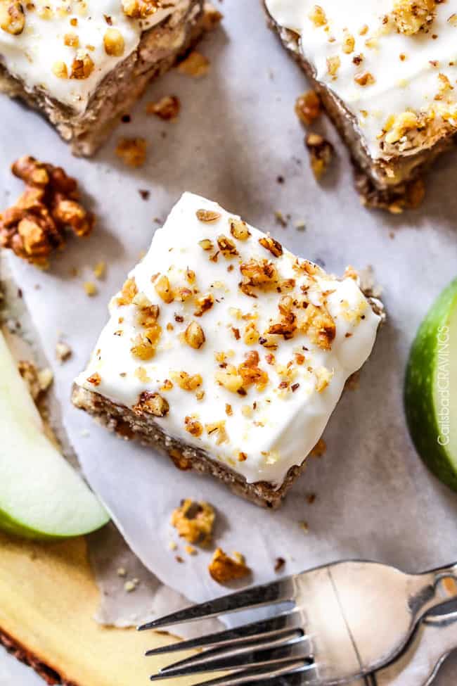 Top view of Maple Apple Spice Cake with Spiced Cream Cheese Frosting with walnuts on top.