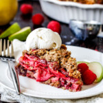 Easy Raspberry Apple Pie with Oatmeal Cookie Crumble Topping is an amazinlgy delicious twist on classic apple pie that everyone will go crazy for! I could eat the crust, filling or topping alone - every part is so good!