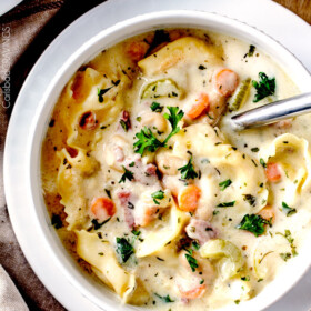 hearty, cozy, Creamy Ham, White Bean Tortellini Soup simmered with onions, carrots, celery and seasonings is SO easy and lick your bowl delicious! love the addition of cheesy tortellini!