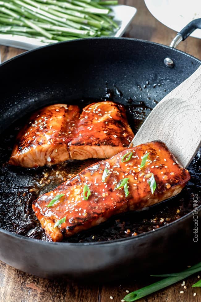 Showing how to make Asian BBQ Salmon in a pan being cooked.