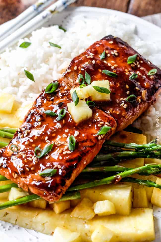 Asian BBQ Salmon on a plate with asparagus and rice.