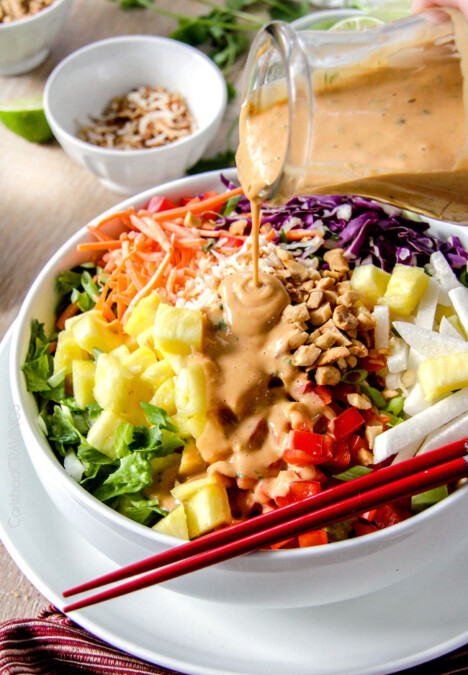 Asian Pineapple Salad with Coconut Peanut Dressing is a salad lover's dream! packed with refreshing pineapple and crunchy peanuts, peppers, carrots, jicama and coconut all doused with the most AMAZING silky Coconut Peanut Dressing that I could drink by itself!