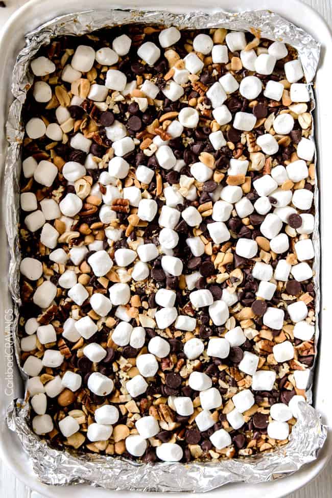 Showing how to make Caramel Nut S'mores Bars adding ingredients to a sauce pan.