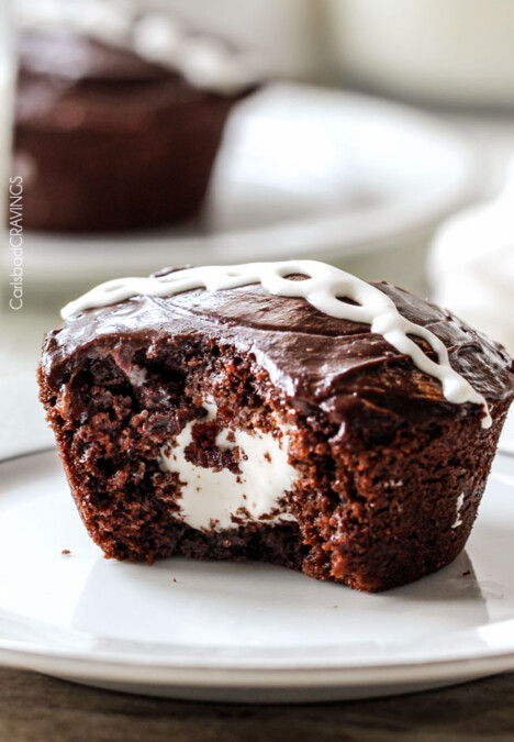 Ding Dong Cupcakes are a rich, moist chocolate cupcake stuffed with creamy marshmallow filling and smothered in a silky chocolate ganache! You will never want to buy Ding Dongs from the store again!