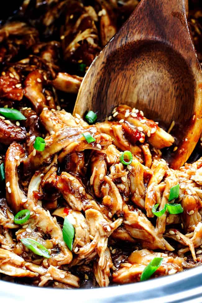 up close of sticky honey soy chicken in the crockpot